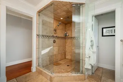 a bathroom with a shower with a glass door at World Cup Coastal Getaway in White Rock