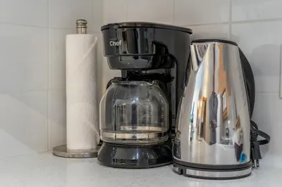 a blender sitting on a counter next to a roll of paper towels at Lodges at Canmore Resort in Canmore
