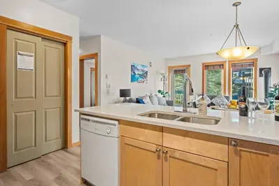 a kitchen with a sink and a counter at Lodges at Canmore Resort in Canmore