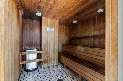 a sauna with wood paneled walls at Central City Location, Bay View, One Free Parking in Vancouver