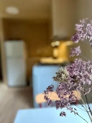 a vase of purple flowers sitting on a table at Riverside Retreat in Cowichan Bay