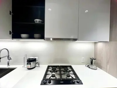 a kitchen with a stove top in a kitchen at Cozy and convenient 1B1B near Richmond center in Richmond