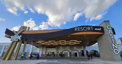 a large building with a sign that reads resort amp at Modern new townhouse in Red Deer