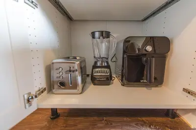 a kitchen shelf with a blender and a toaster at Modern Lynn Valley Retreat with Mountain and City Views in North Vancouver