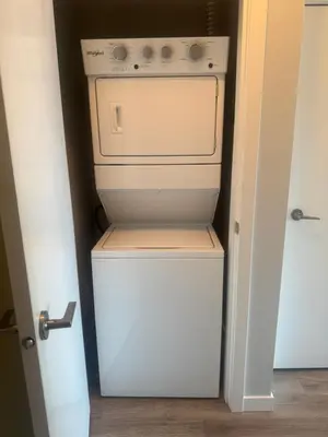 a small kitchen with a stove and a refrigerator at Mollies Alpha in Langford