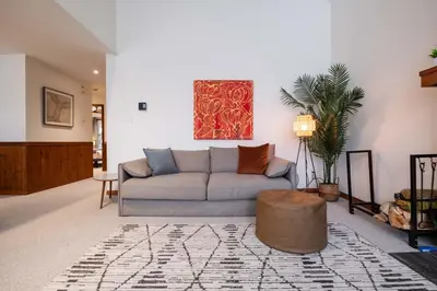 a living room with a couch and a rug at Blackcomb Greens 33 by Outpost Whistler in Whistler