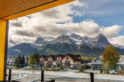 a view of a mountain range from a town at Ravens Nest - Private Hot Tub in Canmore