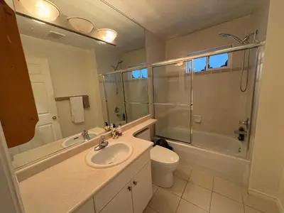a bathroom with a sink and a shower and a toilet at Vancouver Home - Downtown 15 Min, Transit Access - Free Parking & Wi-Fi in Vancouver