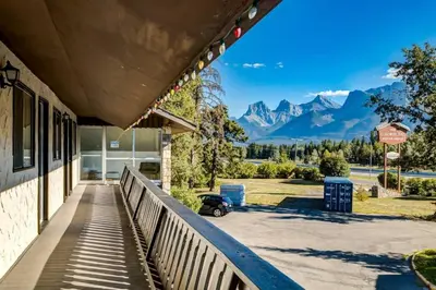 a building with a view of the mountains at Gateway Suites Perfect rest on your way to Banff in Canmore