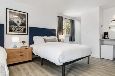 a bedroom with a large bed and a window at Gateway Suites Perfect Escape to explore Banff in Canmore