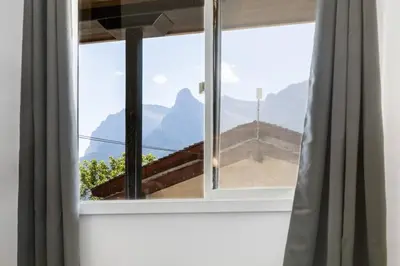 a window with a view of a mountain view at Gateway Suites Lovely views near Banff in Canmore