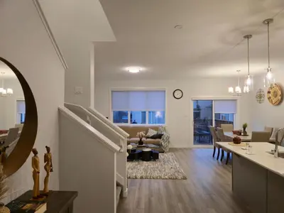 a living room with a kitchen and a living room at Sunny's Homes in Edmonton