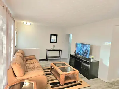 a living room with a couch and a flat screen tv at Kirvia's retreat 