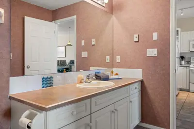 a bathroom with a sink and a mirror at The Pinnacle in Fairmont 1BR Condo Near Hot Springs in Fairmont Hot Springs