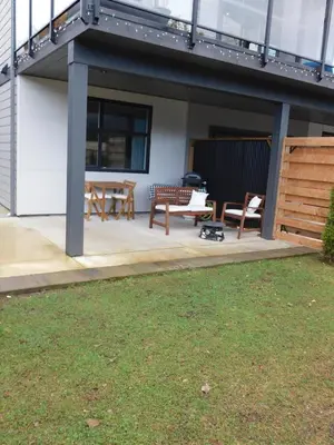 a patio with a table and chairs and a bench at Lakeview Escape in Northshore Estates in Lake Cowichan