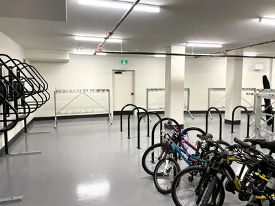 a room with a bunch of bikes parked in it at Black Bears Den, Heated Pool, Hot Tub, Brand NEW! in Canmore