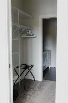 a room with a closet with shelves in it at The Après Arcade in Sun Peaks