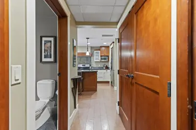 a bathroom with a toilet and a sink in a kitchen at Mountain View Escape Sleeps 6 with Hot Tub and Pool in Canmore