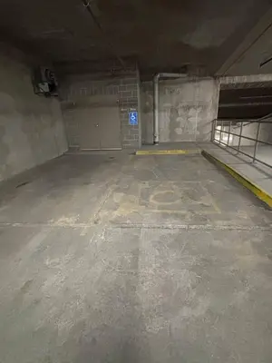an empty parking garage with a large room with a door at Spacious Rockies Escape near Banff Hot tub and Gym in Canmore