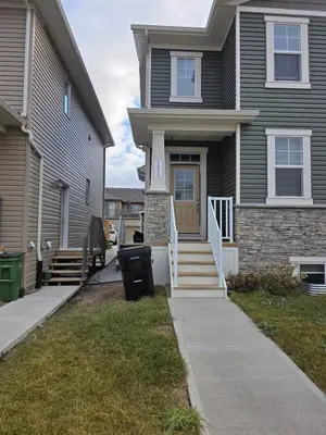 a house with a front door and a sidewalk at Amaville - Two BRM Suite in West Edmonton in Edmonton