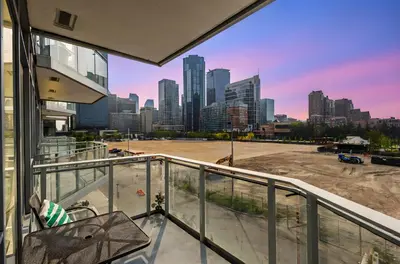 a view of a city skyline from the balcony of a building at Parkside at Waterfront in Downtown Calgary in Calgary