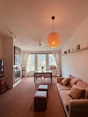 a living room with a couch and a table at Stunning Mountain View in Fairmont Hot Springs