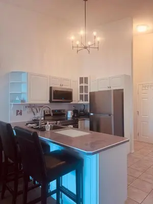 a kitchen with a kitchen island with a counter top at Stunning Mountain View in Fairmont Hot Springs
