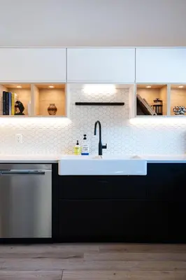 a kitchen with a sink and a dishwasher at CAPOW House in Revelstoke