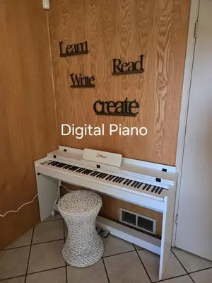 a white piano with a stool next to it at Self Check-In Keyless Private Entry DBL Queen Suite in Mission City