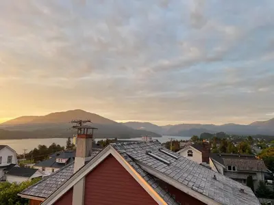 a view of a town with a mountain in the background at The Golden Sky Sanctuary at the Algonquin Residence in Prince Rupert