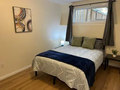 a small bedroom with a bed with a window at 3 Adjacent 4-bed Homes - Park Views, Fully Stocked in Grande Prairie