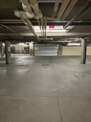 an empty parking lot in an empty parking garage at Cozy Oasis 2BR with Hot Tub and Gym 10 Mins to DT in Dead Man's Flats