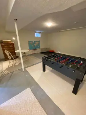 a room with a table with tools on it at New! Spacious Bright Home in GREAT Location in Red Deer