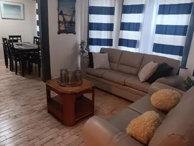 a living room with a couch and a table at 347 Des Meurons Street Unit A and Unit B in Bélanger