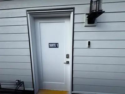 a white door with the word swift written on it at Brand new fully private Garden Suite 1 in Delta