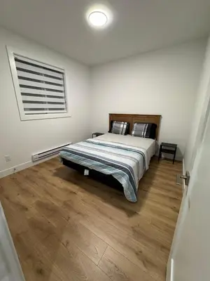 a bedroom with a bed and a window at Brand new fully Private Garden suite 2 in Delta
