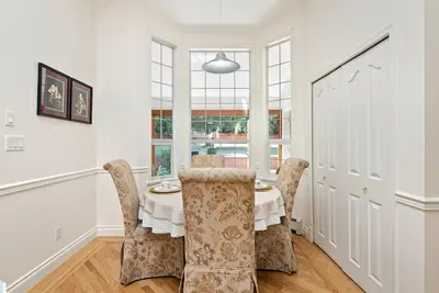 a dining room with a table and chairs at Surrey Nature Retreat 4BDR Home in Surrey