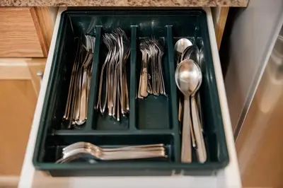 a tray filled with utensils in a kitchen at Cozy Canmore 2-Bedroom Retreat in Canmore