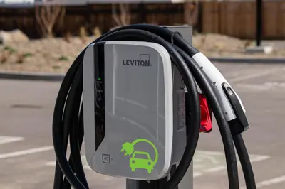 a electric meter with a green car on it at Vita Resort Vernon - Modern Studio on Okanagan Lake in Vernon