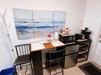 a kitchen with a counter top with a microwave and a microwave at New Langford Suite near Lake & Mall, Free Parking in Goldstream Station