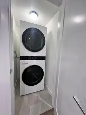 a laundry room with a washer and dryer at Kris Anclam in Langley