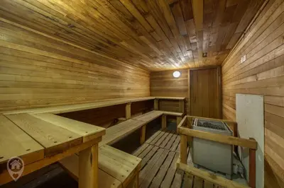 a large wooden sauna with benches at InnWest by StayIn in Kimberley
