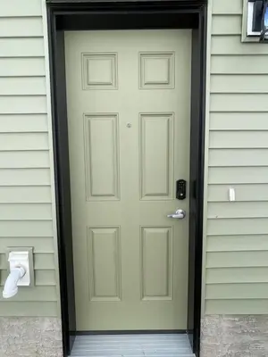 a front door of a house with a green door at Cozy and modern two bedroom guest suite in Calgary