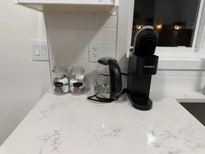 a kitchen counter with a blender on a counter top at Modern 1BR Suite with Laundry, Workspace & WiFi in Langford