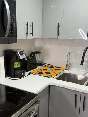 a kitchen with a counter top with a toaster oven at Serenity Suite 3603 in Edmonton