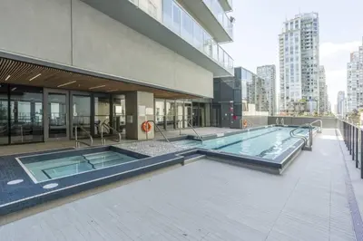 a swimming pool on the side of a building at Corporate Stays Telus Gardens 1 Bedroom in Vancouver