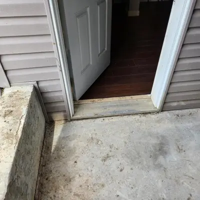 an open door to a house with a concrete doorstep at beautiful private house in Edmonton