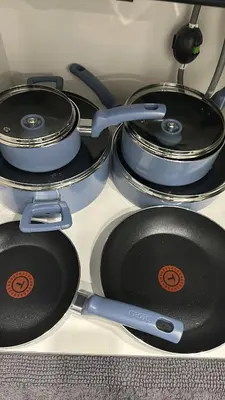 a group of pots and pans sitting on a stove at Modern Basement Suite near West Edmonton Mall in Edmonton