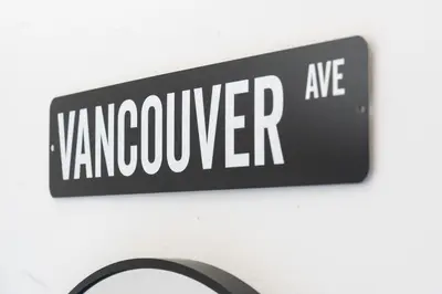 a sign that reads vancouver ave on a wall at Heritage Home in Heart of City with free Parking in Vancouver