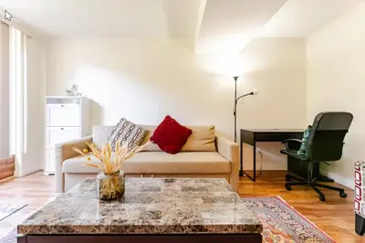 a living room with a couch and a table at Spacious & Cozy 1 Bedroom Suite in North Vancouver in North Vancouver